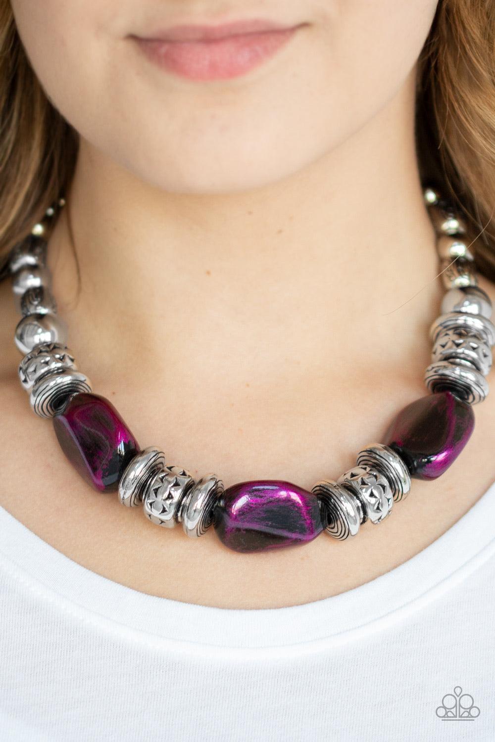 Paparazzi Accessories Colorfully Confident - Purple A collection of classic silver beads, ornate silver accents, and metallic purple faux rock beads are threaded along an invisible wire below the collar for a statement-making finish. Features an adjustabl