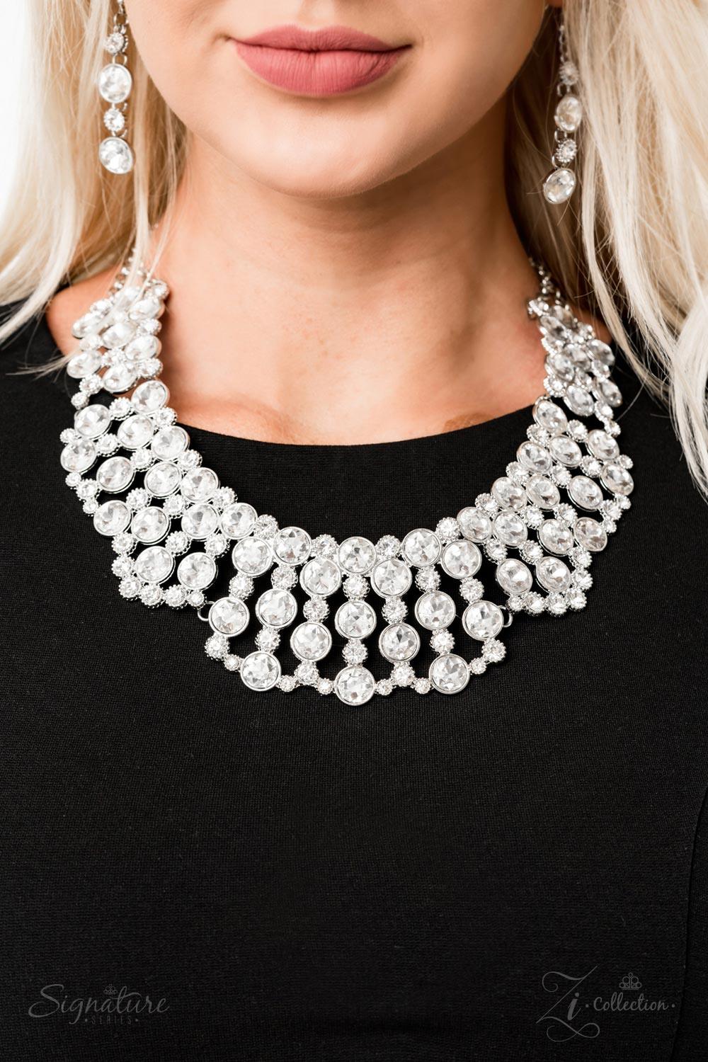 Paparazzi Accessories The Heather V Two strands of silver chain give way to a gorgeous collection of glassy white rhinestones nestled in sleek silver frames. Some of the frames are dotted in texture, adding intricate detail to the vintage-inspired design.