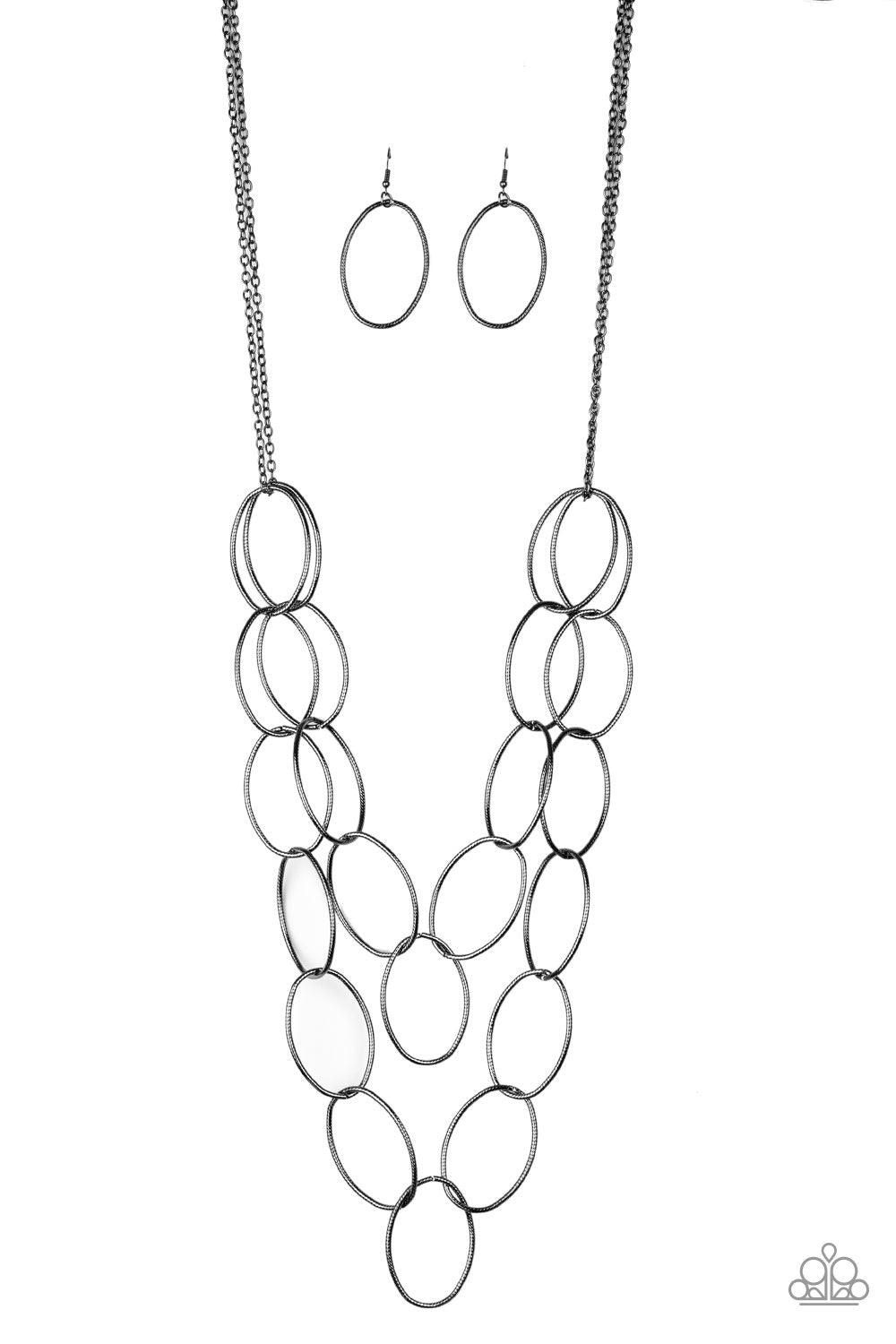 Paparazzi Accessories Move On OVAL! - Black Etched in antiqued textures, pairs of oversized gunmetal ovals link across the chest for a bold industrial look. Features an adjustable clasp closure. Jewelry
