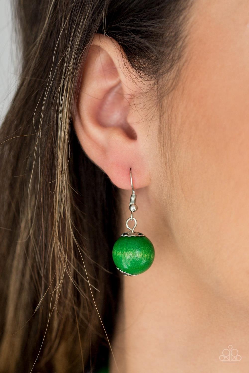 Paparazzi Accessories Tahiti Tropic - Green Brushed in a refreshing green finish, strands of vivacious wooden beads subtly twist across the chest for a summery look. Jewelry