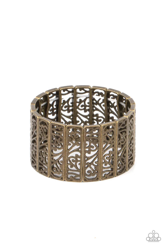 Paparazzi Accessories Ornate Orchards - Brass Filled with vine-like filigree centers, dainty brass rectangular frames are threaded along stretchy bands around the wrist for a seasonal inspired fashion. Sold as one individual bracelet.