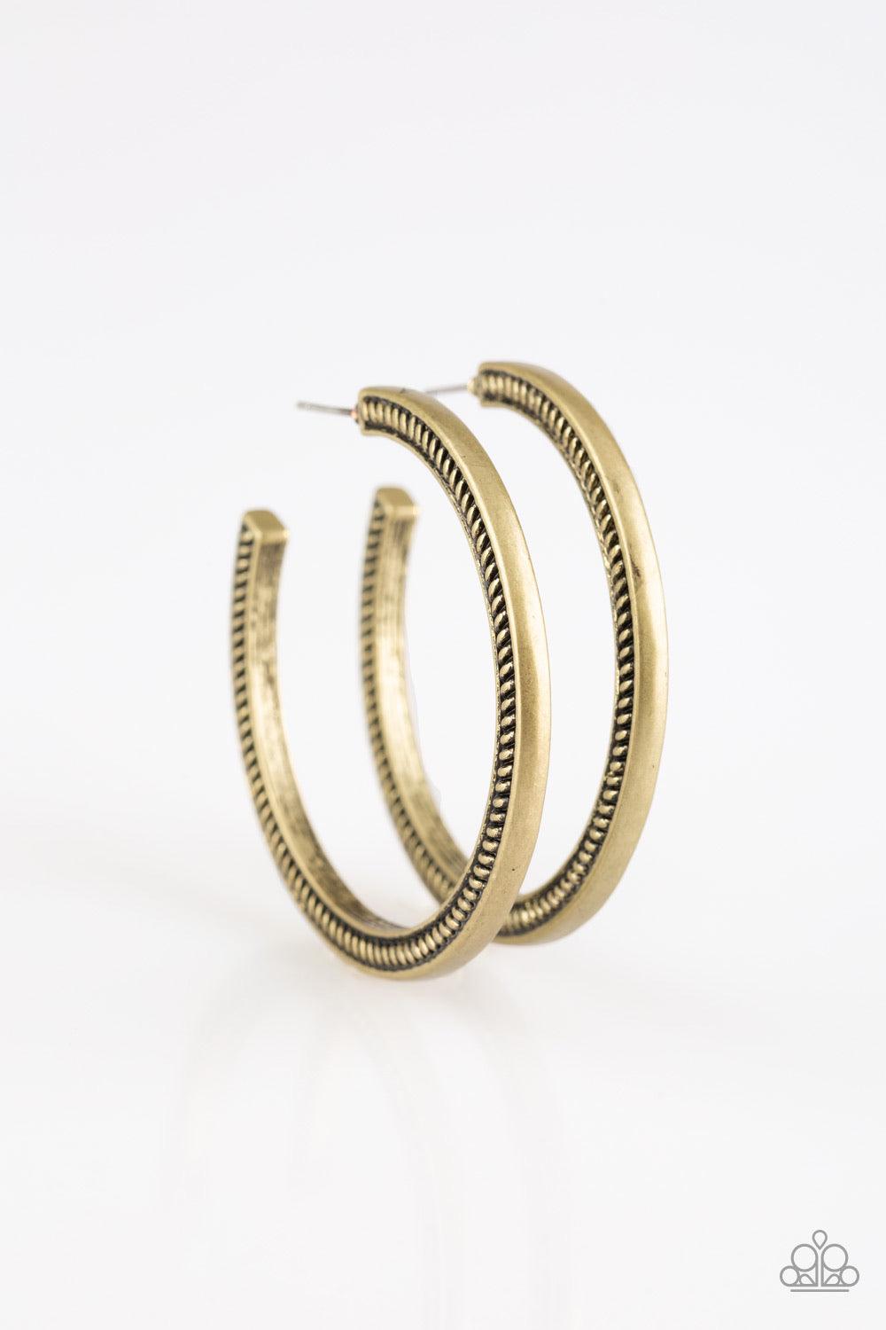 Paparazzi Accessories This is My Tribe - Brass Radiating with tactile textures, a glistening brass hoop curls around the ear for a tribal inspired look. Earring attaches to a standard post fitting. Hoop measures 2" in diameter. Sold as one pair of hoop ea
