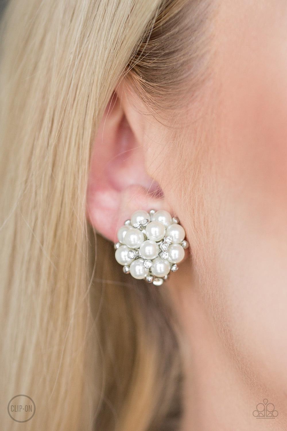 Paparazzi Accessories Par Pearl - White *Clip-On Dainty white pearls and glassy white rhinestones coalesce into a bubbly frame for a timeless look. Earring attaches to a standard clip-on earring. Jewelry