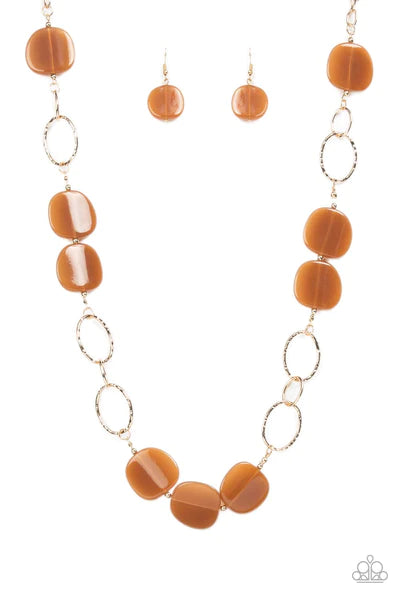 Paparazzi Accessories Posh Promenade - Browm An oversized collection of brown acrylic accents adorn sections of oversized textured gold links, resulting in a refined pop of color across the chest. Features an adjustable clasp closure. Sold as one individu