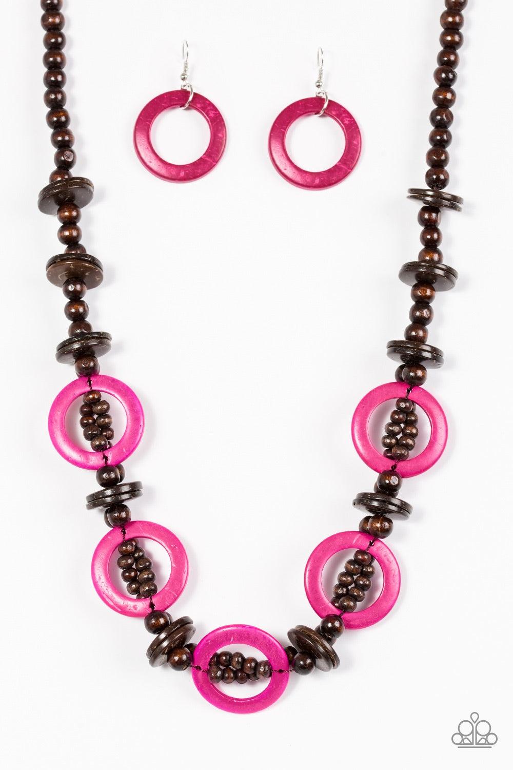 Paparazzi Accessories Fiji Foxtrot - Pink Mismatched brown wooden beads are threaded along a brown cord for an earthy look. Vivacious pink wooden discs connect with beaded links across the chest for a summery finish. Jewelry