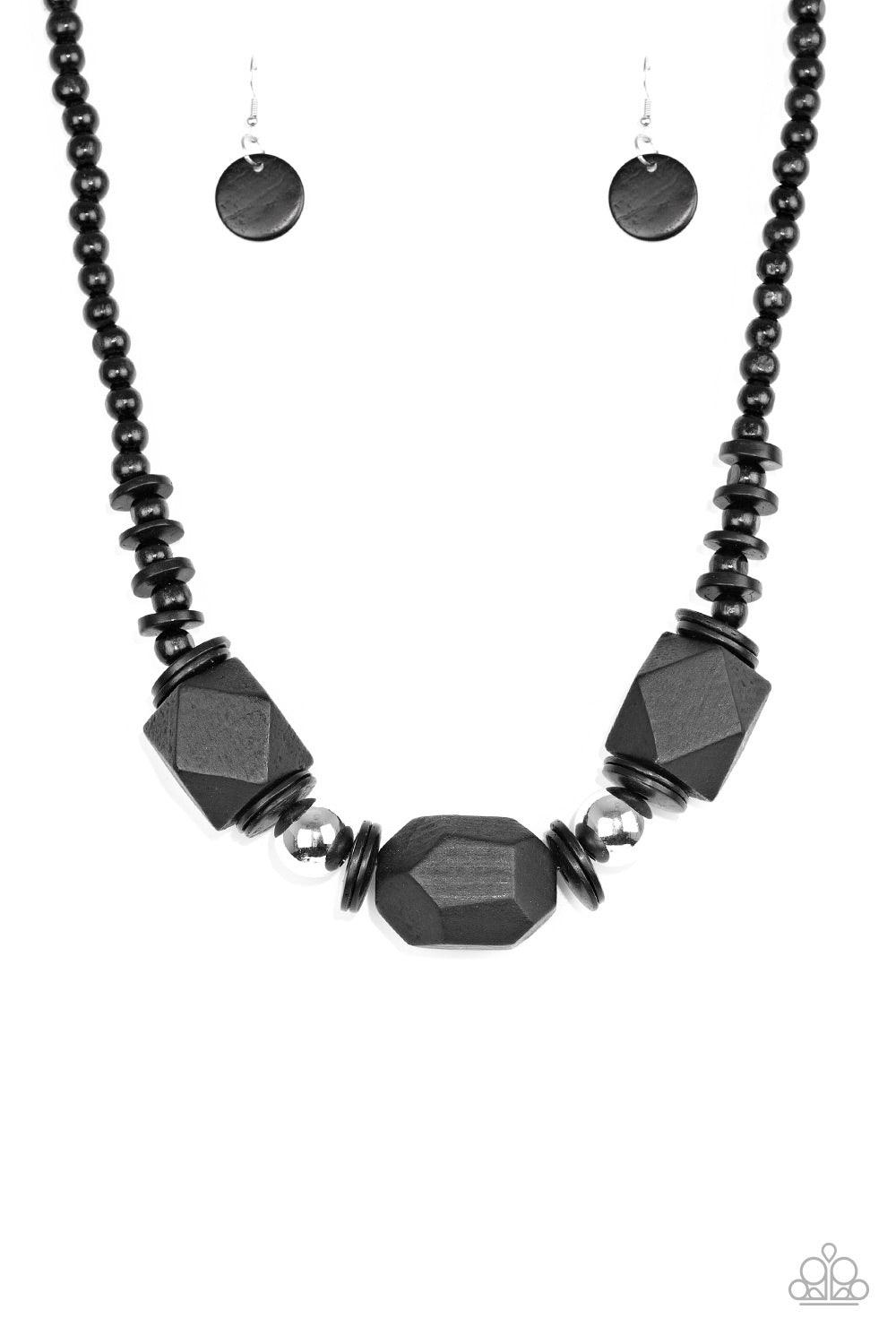 Paparazzi Accessories Costa Maya Majesty - Black Featuring abstract geometric finishes, mismatched black wooden beads are threaded along shiny black cording. Dramatic silver beads are sprinkled between the earthy beading, creating a bold seasonal look bel