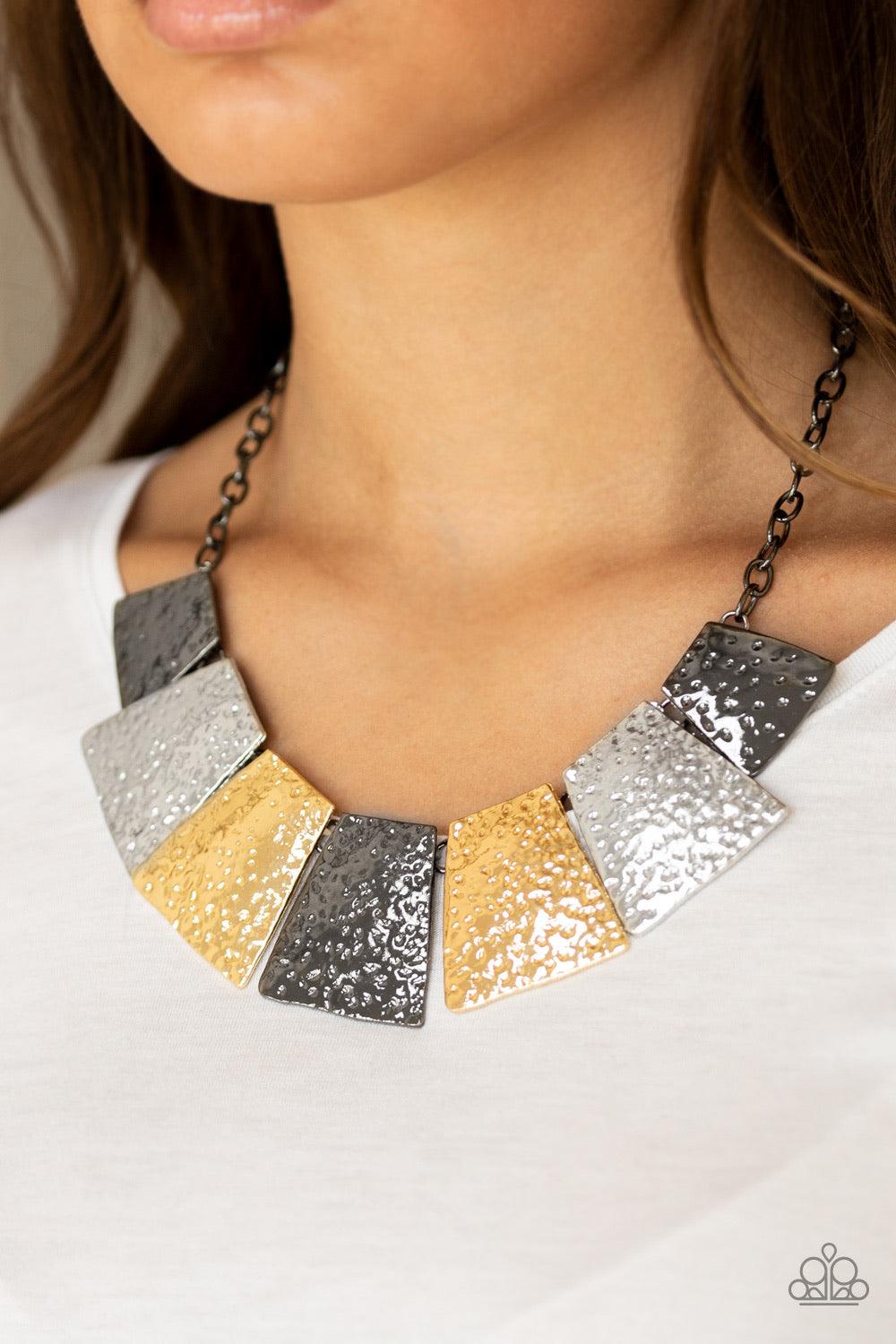 Paparazzi Accessories Here Comes The Huntress - Multi Featuring flared edges, delicately hammered gunmetal, silver, and gold plates link below the collar for a fierce look. Features an adjustable clasp closure. Sold as one individual necklace. Includes on