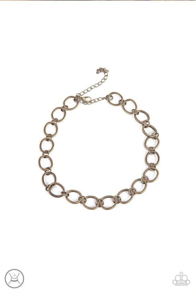 Paparazzi Accessories 90’s Nostalgia - Brass Brushed in an antiqued finish, imperfectly shaped circles link together for a gritty industrial statement. Features an adjustable clasp closure. Jewelry