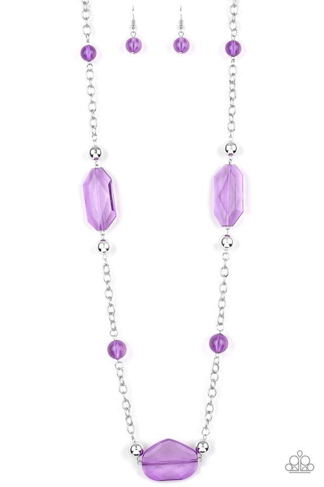 Paparazzi Accessories Crystal Charm - Purple A collection of glassy purple beads, shiny silver beads, and oversized faceted crystal-like beads trickle along a shimmery silver chain across the chest for a whimsically refined look. Features an adjustable cl