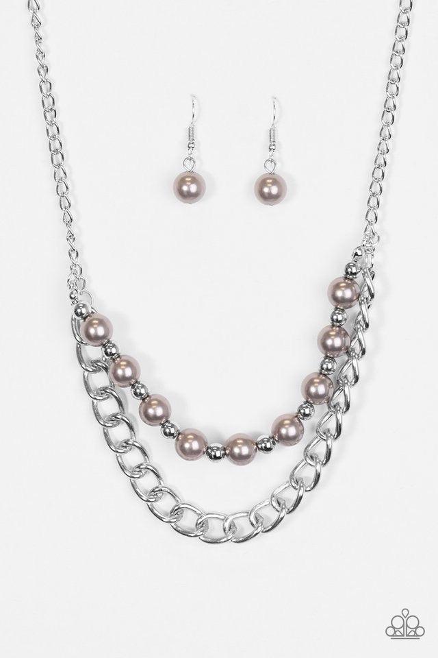 Paparazzi Accessories Glam And Grind - Silver Pearly silver and classic silver beads are threaded along a skinny wire. The pearly beading gives way to a bold strand of silver chain, creating edgy layers below the collar. Features an adjustable clasp closu