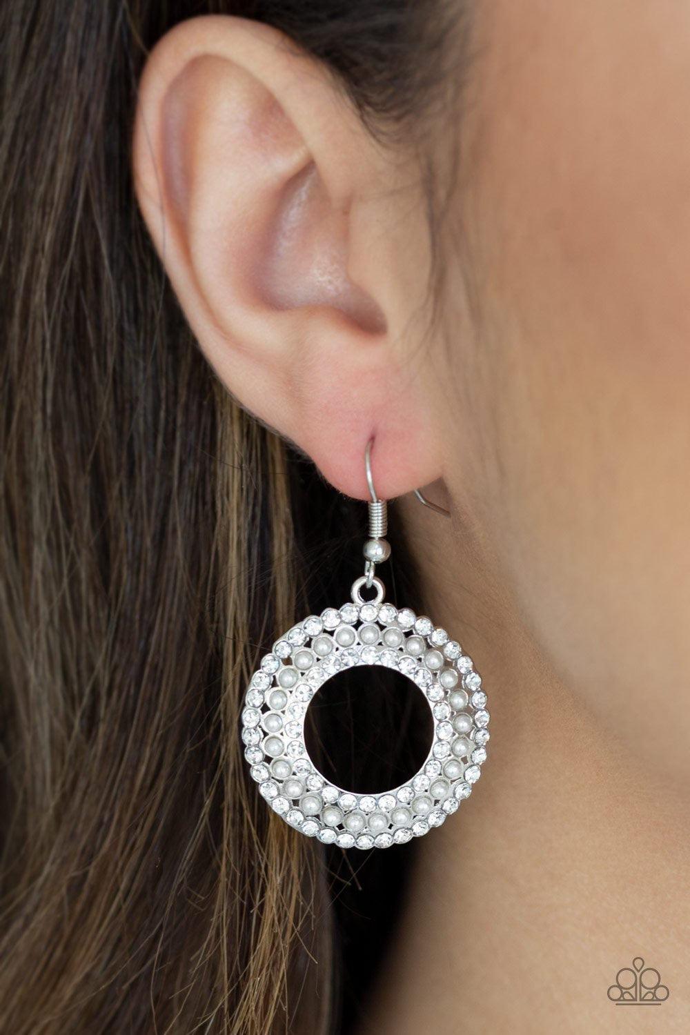 Paparazzi Accessories Sparkle Splurge - Silver A ring of dainty gray pearls is flanked by rings of glassy white rhinestones, coalescing into a timeless piece. Earring attaches to a standard fishhook fitting. Jewelry