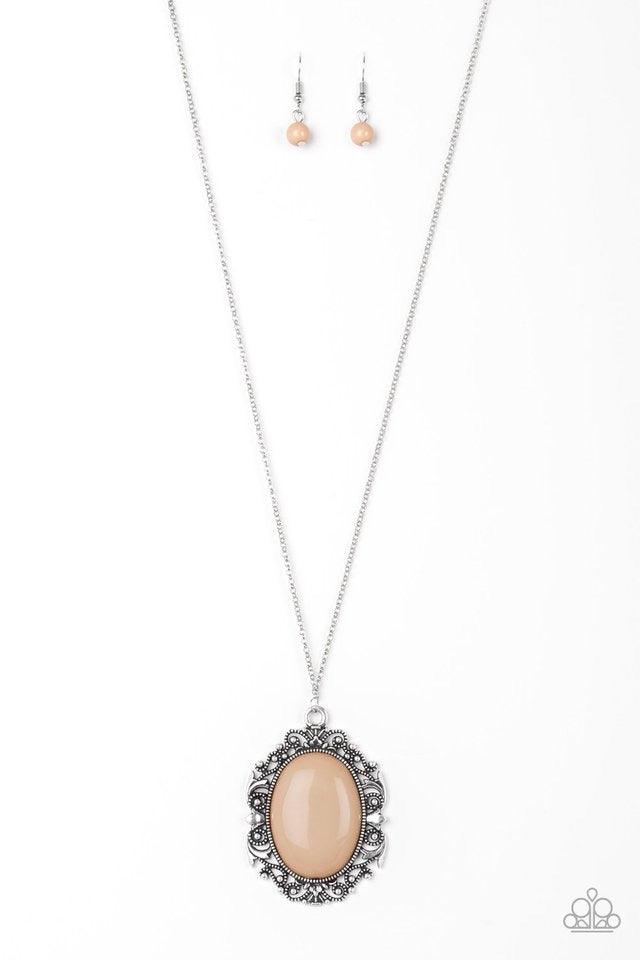 Paparazzi Accessories Vintage Vanity - Brown Featuring a faux rock finish, a shiny brown bead is pressed into the center of a frilly silver frame radiating with studded details. The dramatic pendant swings from the bottom of a lengthened silver chain for