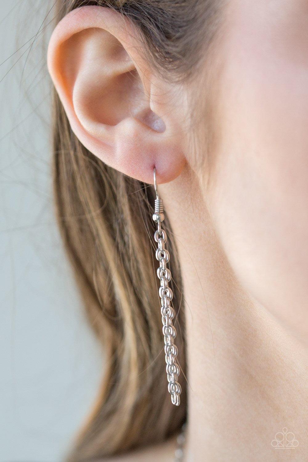 Paparazzi Accessories Summer Sunbeam - Pink A vivacious pink stone is pressed into the center of a large silver teardrop radiating with shimmery sunburst patterns. The tribal inspired pendant swings from the bottom of a lengthened silver chain for a drama