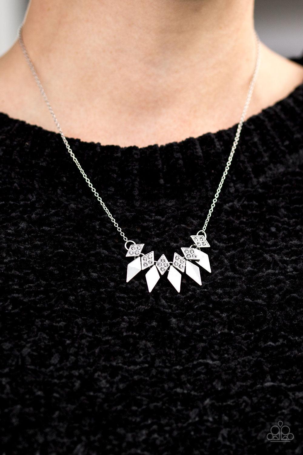 Paparazzi Accessories Over The Edge - Silver Encrusted in glittery smoky rhinestones, dainty diamond-shaped frames give way to matching silver frames, creating an edgy fringe below the collar. Features an adjustable clasp closure. Jewelry