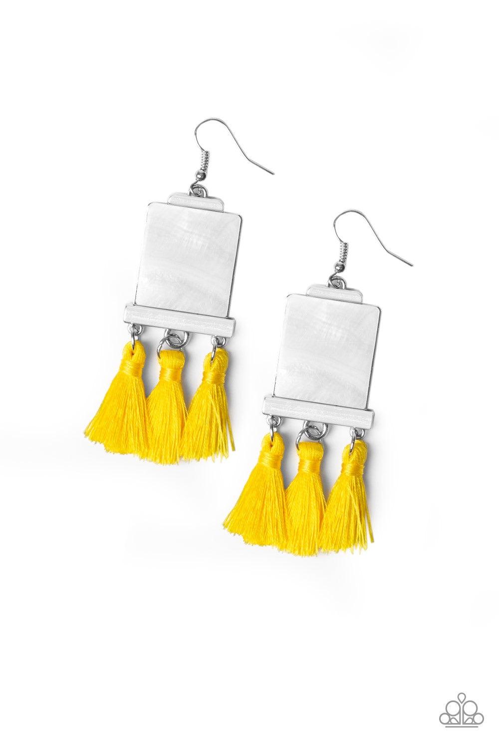 Paparazzi Accessories Tassel Retreat - Yellow A rectangular shell-like accent is nestled into a shiny silver frame. A trio of shiny yellow threaded tassels swing from the bottom of the incandescent frame for a flirtatious finish. Earring attaches to a sta