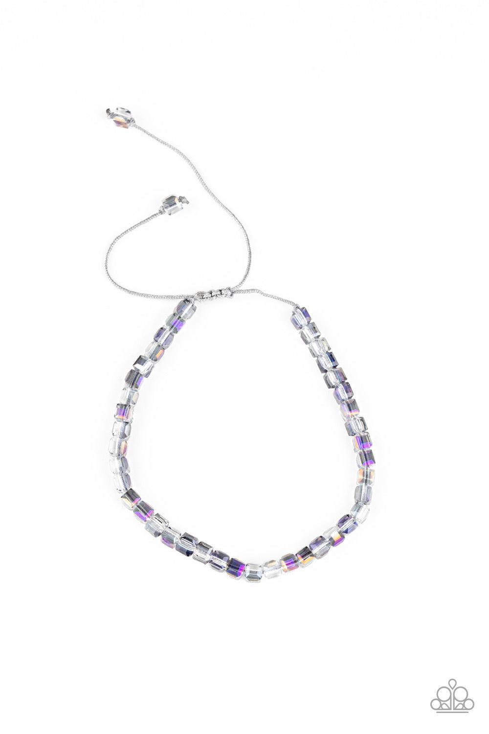 Paparazzi Accessories Prismatic Maverick - Purple Flecked in oil spill accents, square crystal-like beads are threaded along a gray cord around the wrist for a prismatic look. Features an adjustable sliding knot closure. Sold as one individual bracelet. J