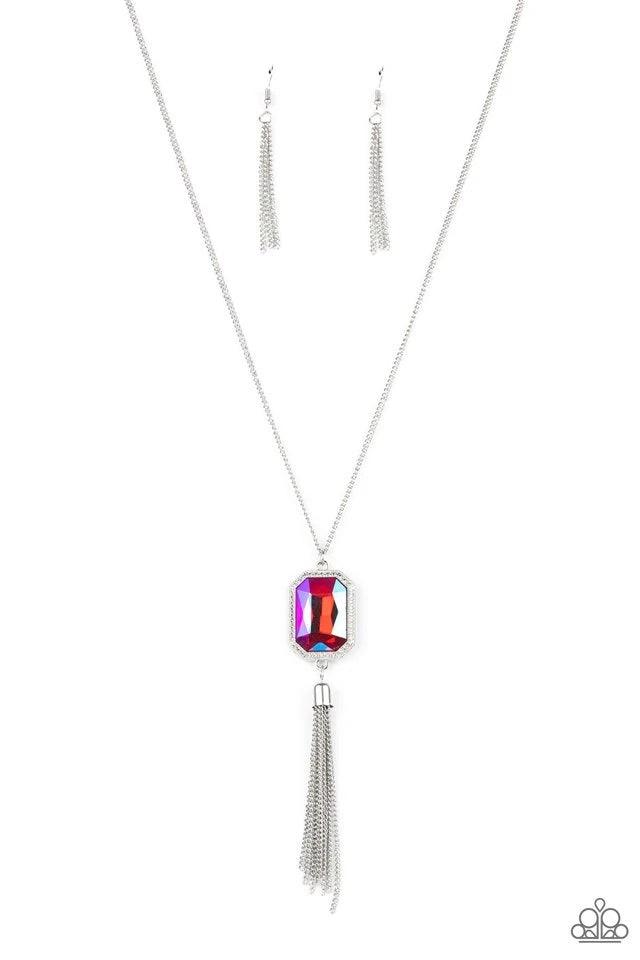 Paparazzi Accessories Blissed Out Opulence - Pink An impressive pink emerald cut gem is pressed into the center of a silver studded frame, creating an ethereal pop of color at the bottom of a lengthened silver chain. A silver chain tassel swings from the