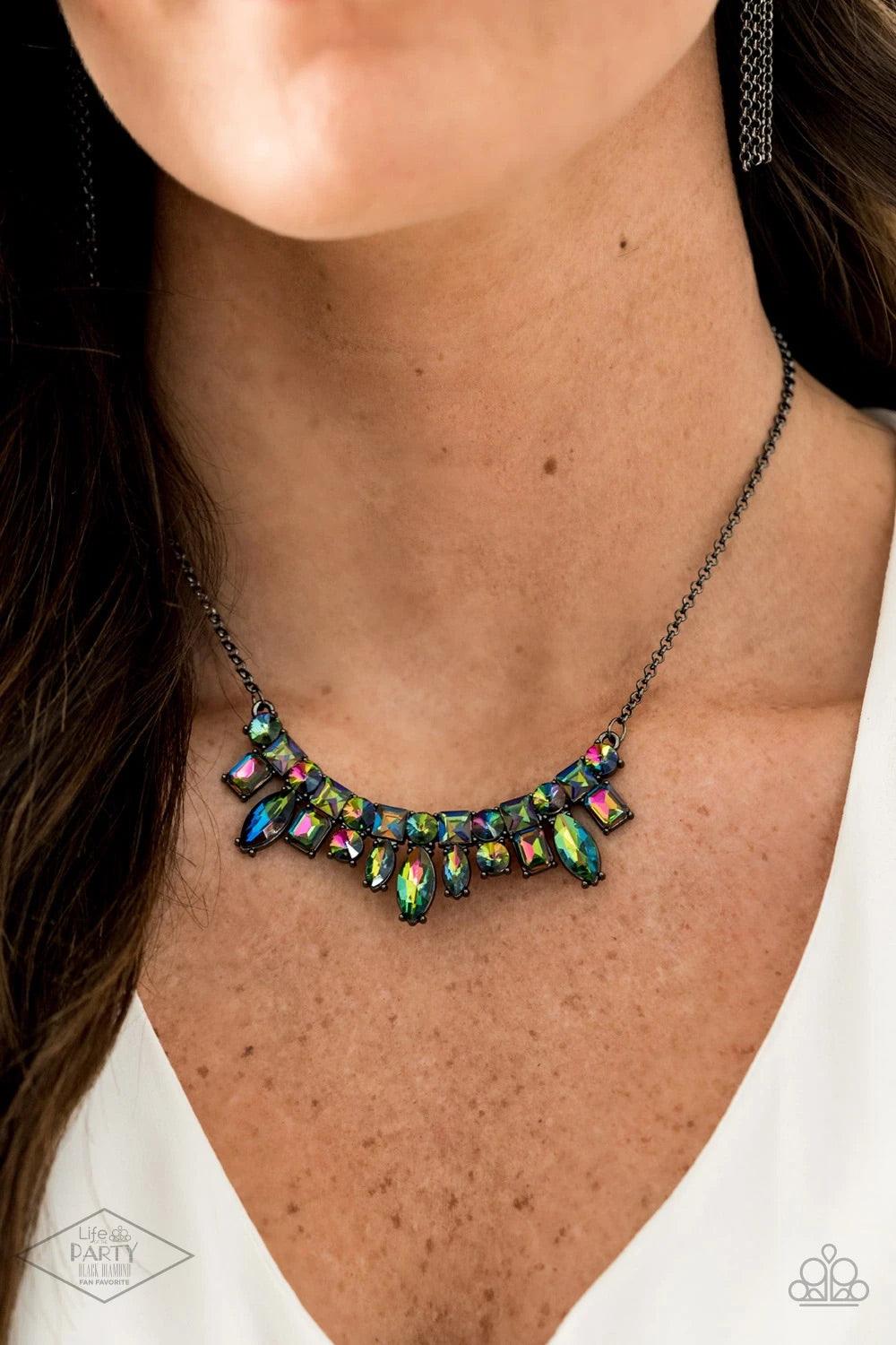 Paparazzi Accessories Wish Upon a ROCK STAR - Multi A collision of round, square, emerald, and marquise cut oil spill rhinestones coalesce into a dazzling pendant below the collar for an edgy elegance. Features an adjustable clasp closure. Sold as one ind