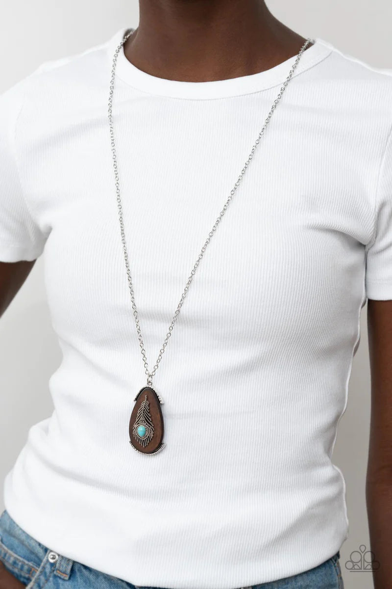 Paparazzi Accessories Personal FOWL - Blue A teardrop turquoise stone adorns a studded silver feather that embellishes an oversized wooden pendant at the bottom of an extended silver chain, resulting in a whimsically rustic pendant. Features an adjustable