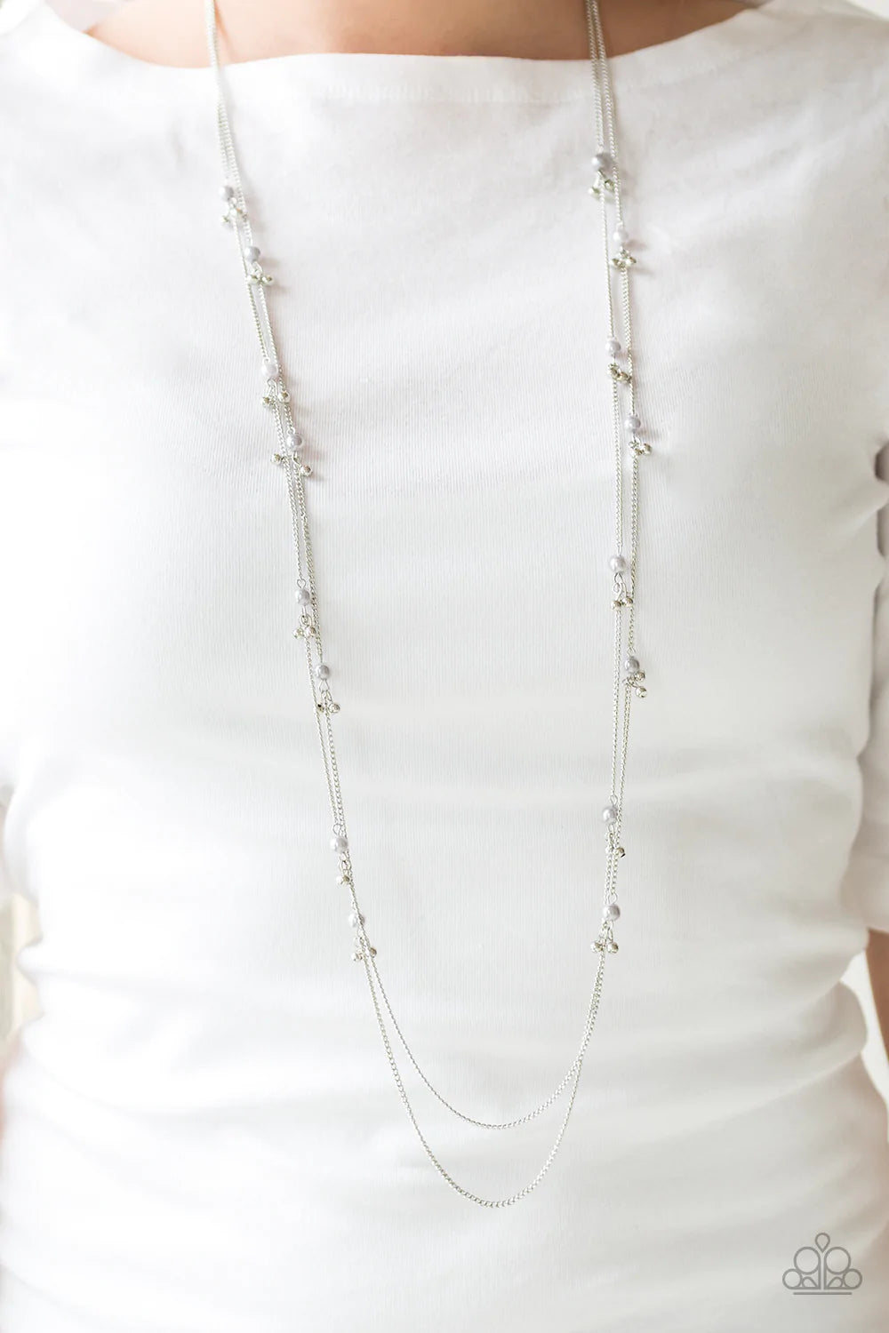 Paparazzi Accessories Ultrawealthy - Silver Infused with pearly accents, pairs of silver beads trickle along dainty silver chains for a glamorous look. Features an adjustable clasp closure. Sold as one individual necklace. Includes one pair of matching ea
