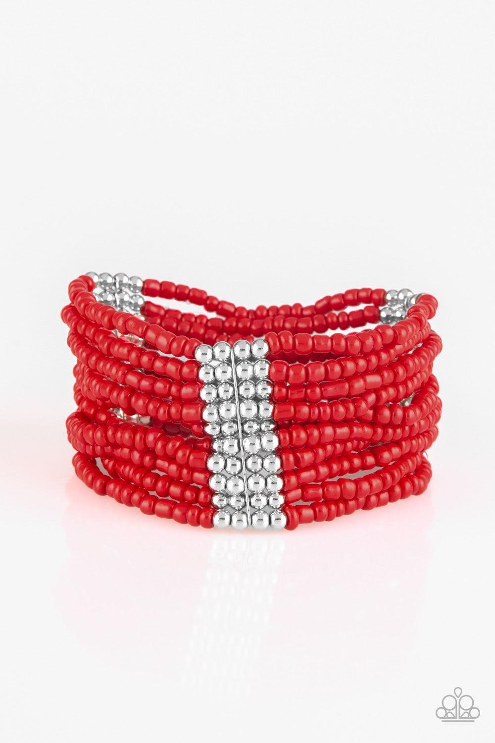 Paparazzi Accessories Outback Odyssey- Red Joined together with metallic fittings, countless red seed beads are threaded along stretchy elastic bands. Sections of dainty silver beads are sprinkled along the colorful layers, adding hints of shimmer to the