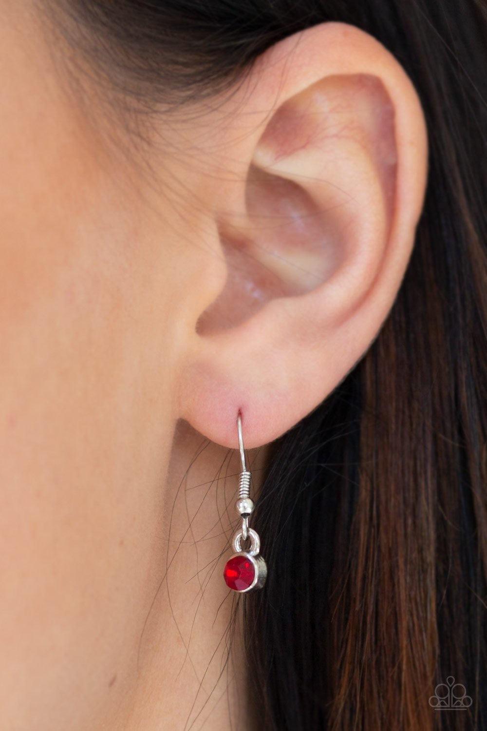 Paparazzi Accessories Sky Quest - Red Glittery red rhinestones are encrusted down the spine of a life-like silver feather. The whimsical pendant swings from the bottom of a lengthened silver chain for a seasonal look. Features an adjustable clasp closure.