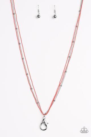 Paparazzi Accessories Colorfully Chic - Orange *Lanyard Painted in a refreshing coral finish, dainty ball-chains and a shimmery silver satellite chain drapes across the chest for a colorful industrial look. A lobster clasp hangs from the bottom of the des