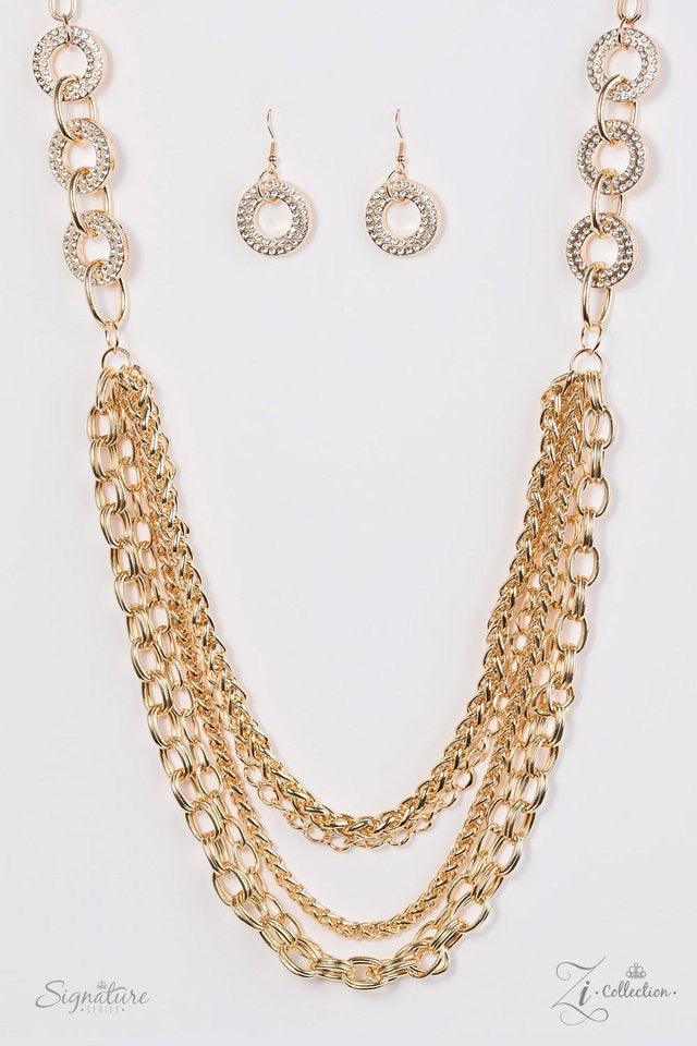 Paparazzi Accessories The Melissa Encrusted in glittery white rhinestones, glistening gold frames give way to layers of shimmery gold chains. Varying in size and shimmer, the bold assortment of gold chains drape across the chest in a fierce and flawless f