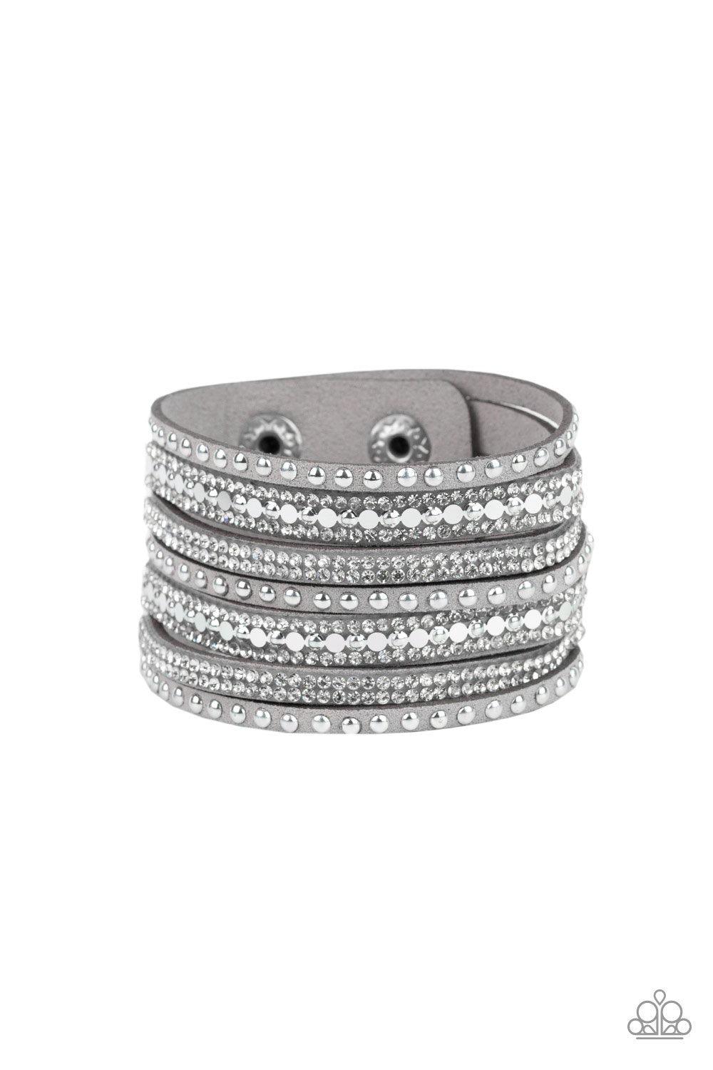 Paparazzi Accessories All Hustle And Hairspray - Silver A thick gray suede band has been spliced into glittery strands encrusted in a collection of dainty silver studs, glittery white rhinestones, and flat silver sequins for a sassy look. Features an adju