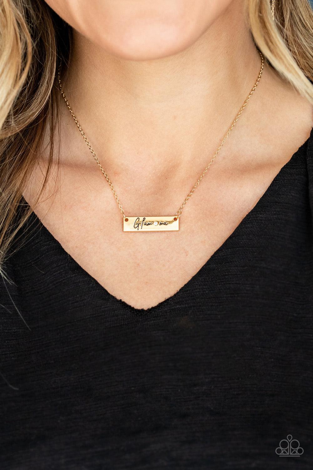 Paparazzi Accessories The GLAM-Ma - Gold Dotted with a dainty white rhinestone, a gold rectangular frame stamped in the sassy word, "Glam-ma", is suspended below the collar by a dainty gold chain for a glamorous look. Features an adjustable clasp closure.