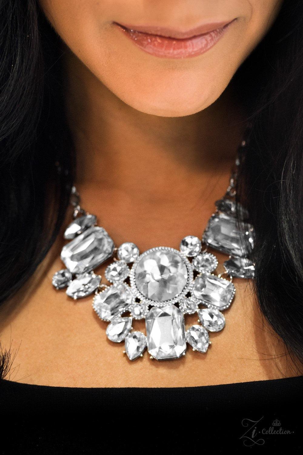 Paparazzi Accessories You-Phoria Featuring an array of round, marquise, teardrop, and elegant emerald style cuts, glittery white gems fan below the collar. Encased in sleek silver frames, the dramatic gems catch and reflect the light, casting blinding shi