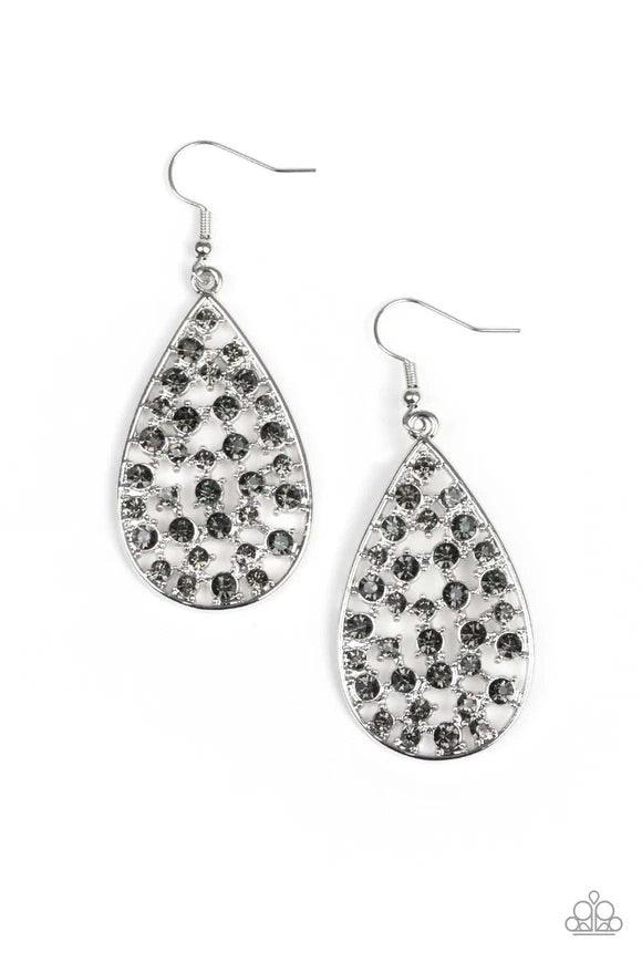 Paparazzi Accessories Call Me Universe - Silver Hints of silver frames and smoky rhinestones collect inside an airy silver teardrop, creating a gorgeous lure. Earring attaches to a standard fishhook fitting.Sold as one pair of earrings. Jewelry
