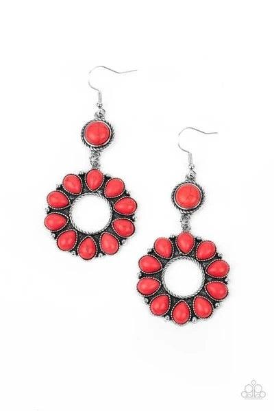 Paparazzi Accessories Back At Ranch - Red A fiery collection of red teardrop stones fan out from a textured silver ring, creating a scalloped floral frame at the bottom of a round red stone dotted frame. Earring attaches to a standard fishhook fitting. So