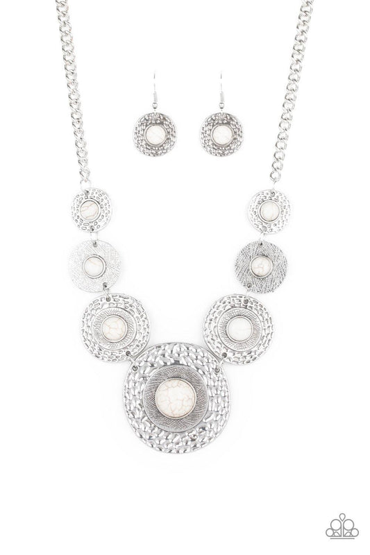Paparazzi Accessories Tiger Trap - White Dotted with smooth white stone centers, mismatched hammered silver frames gradually increase in size as they link below the collar for a fierce look. Features an adjustable clasp closure. Jewelry
