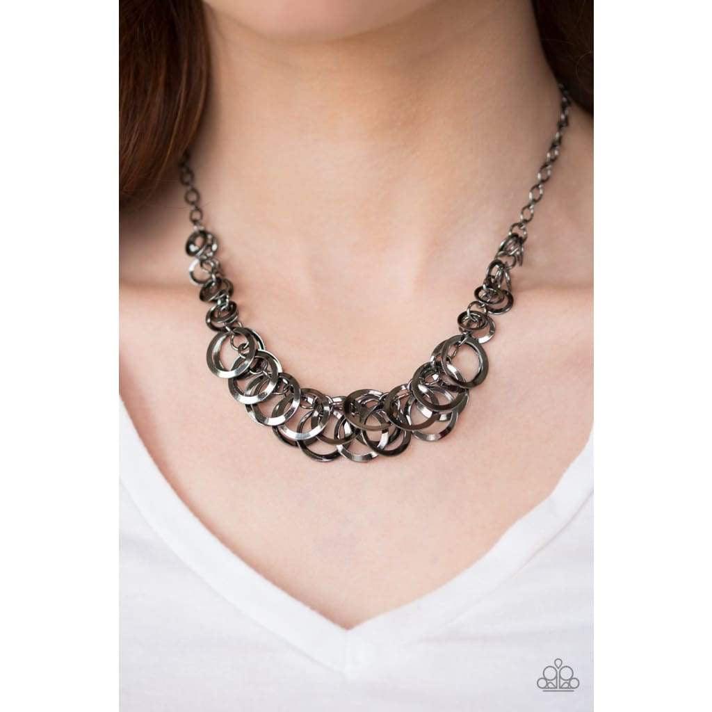 Paparazzi Accessories Royal Circus - Black Glistening gunmetal hoops swing from the bottom of a bold gunmetal chain, creating a flirty fringe below the collar. Features an adjustable clasp closure. Sold as one individual necklace. Includes one pair of mat