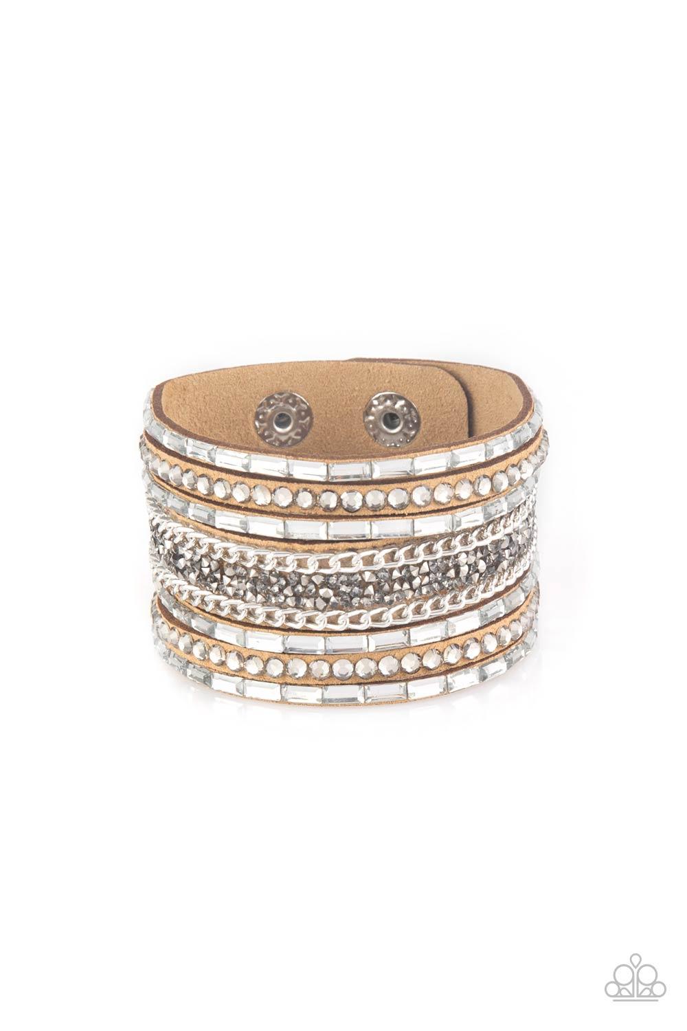 Paparazzi Accessories Rhinestone Rumble - Brown White emerald-cut rhinestones, smoky round rhinestones, and metallic prism-shaped rhinestones are sprinkled along strands of brown suede. Shimmery silver chain is added to the mix for a sassy industrial fini