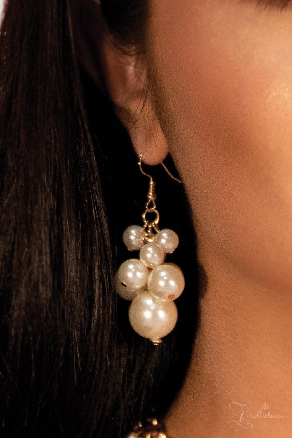 Paparazzi Accessories Exec-YOU-tive Clusters of elegant white pearls swing from a tapered net of interlocking gold chains, creating an effervescent statement piece. The bubbly fringe sits just below the collar, giving off a playfully professional vibe. Fe