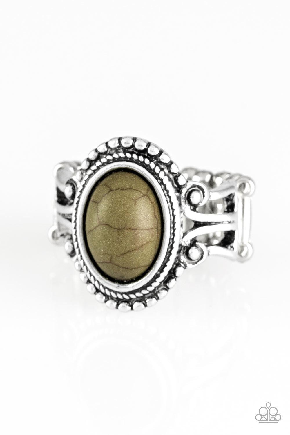 Paparazzi Accessories All The Worlds A STAGECOACH - Green An earthy green stone is pressed into the center of a silver band radiating with silver studs for a seasonal look. Features a stretchy band for a flexible fit. Sold as one individual ring. Jewelry