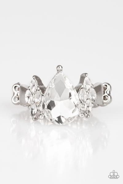Paparazzi Accessories Yas Queen - White A dramatic white teardrop gem is pressed into the center of a dainty silver band. Featuring regal marquise-cuts, dainty white rhinestones flank the sparkling teardrop center for a glamorous finish. Features a dainty