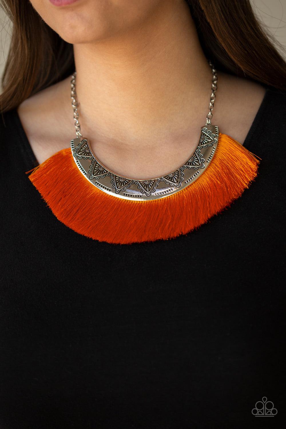 Paparazzi Accessories Might And Mane - Orange A plume of shiny orange thread flares out from the bottom of a silver half-moon frame stamped in tribal inspired patterns, creating a fierce fringe below the collar. Features an adjustable clasp closure. Jewel