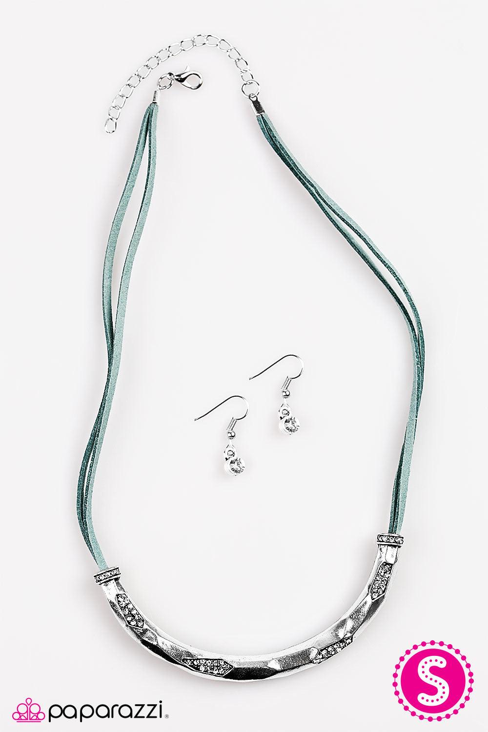 Paparazzi Accessories The Glitter Rush - Blue A hammered silver bar slides along strands of blue suede, dipping just below the collar. Layers of silver are chipped away, revealing hints of sparkling rhinestone accents for a handcrafted finish. Features an