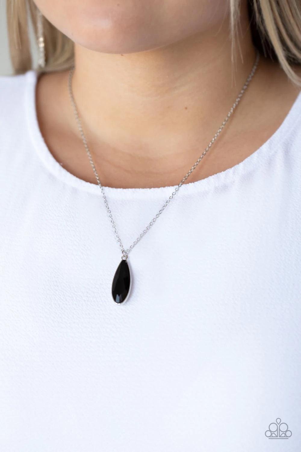 Paparazzi Accessories Prismatically Polished - Black Encased in a sleek silver fitting, an elongated black teardrop gem swings from the bottom of a classic silver chain below the collar for a timeless elegance. Features an adjustable clasp closure. Sold a