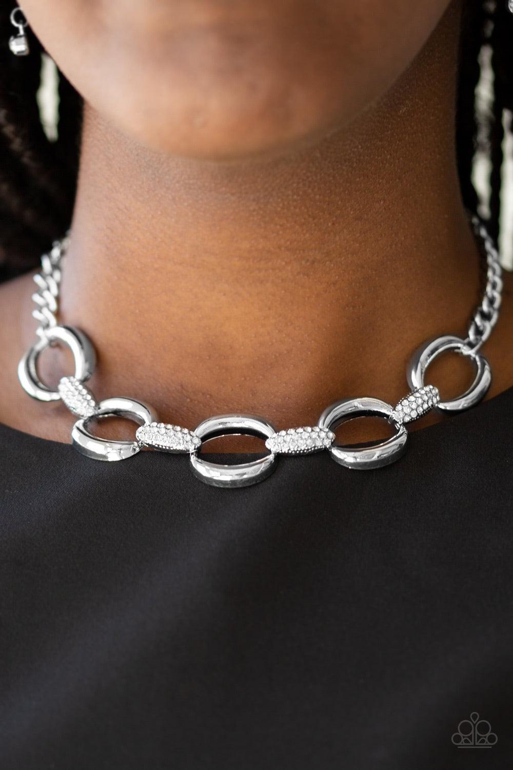 Paparazzi Accessories Boss Boulevard - White Bold silver links join with white rhinestone encrusted frames below the collar for a fierce look. Features an adjustable clasp closure. Jewelry