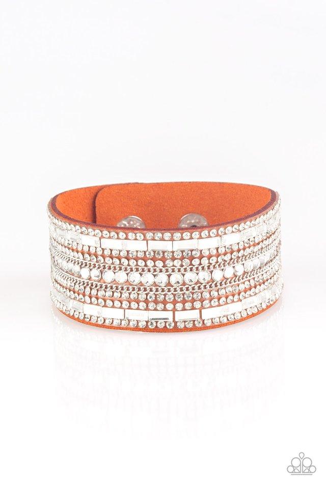 Paparazzi Accessories Rebel Radiance - Orange Featuring classic round and edgy emerald style cuts, glittery white rhinestones and glistening silver chains are encrusted along bands of orange suede for a sassy look. Features an adjustable snap closure. Jew