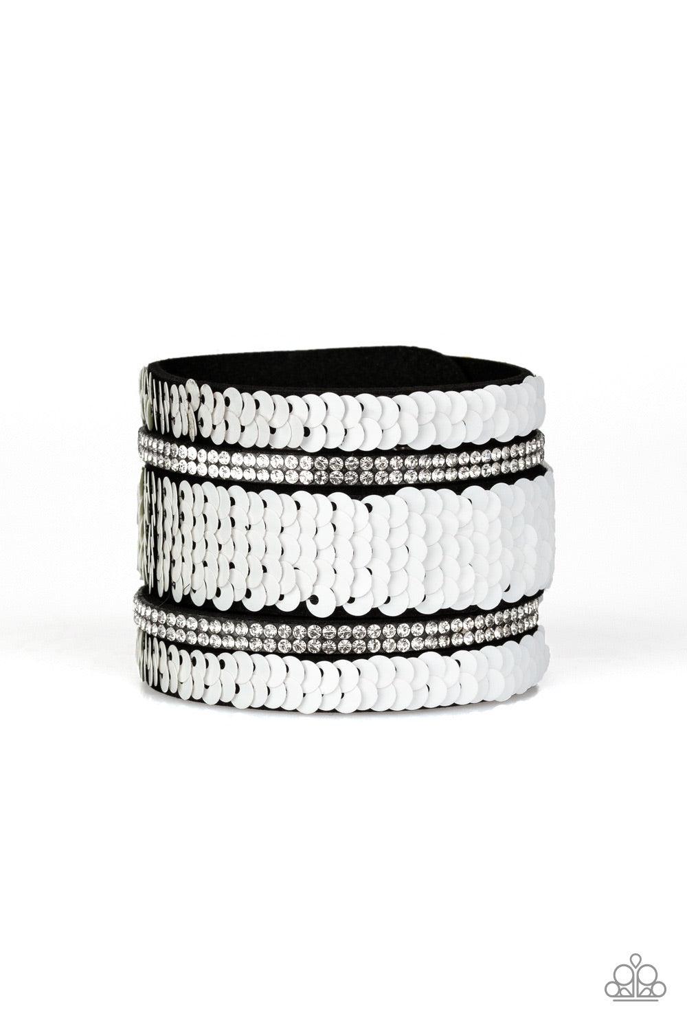 Paparazzi Accessories MERMAID Service - White Infused with strands of blinding white rhinestones, row after row of shimmery sequins are stitched across the front of a spliced black suede band. Bracelet features reversible sequins that change from white to