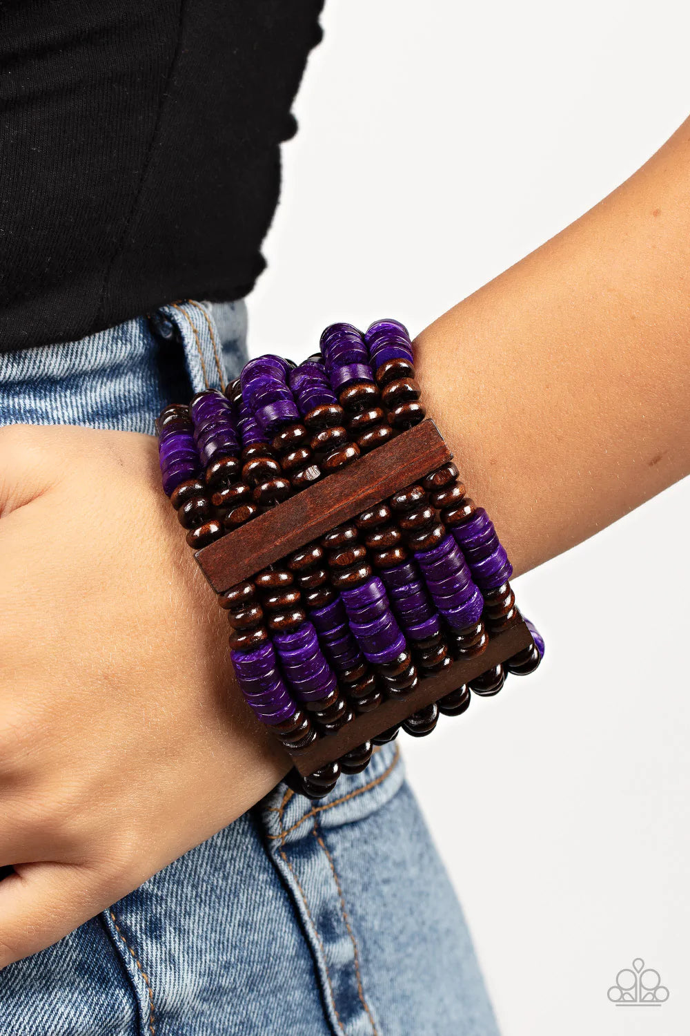 Paparazzi Accessories Vacay Vogue - Purple Held together by rectangular wooden frames, rows of brown wooden and distressed purple discs are threaded along stretchy bands around the wrist for a seasonal pop of color around the wrist. Sold as one individual