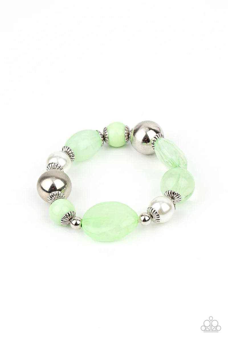 Paparazzi Accessories Resort Ritz - Green A lavish assortment of white pearls, silver accents, and glassy and acrylic Green Ash beads are threaded along a stretchy band around the wrist for a refreshing pop of color. Sold as one individual bracelet. Jewel