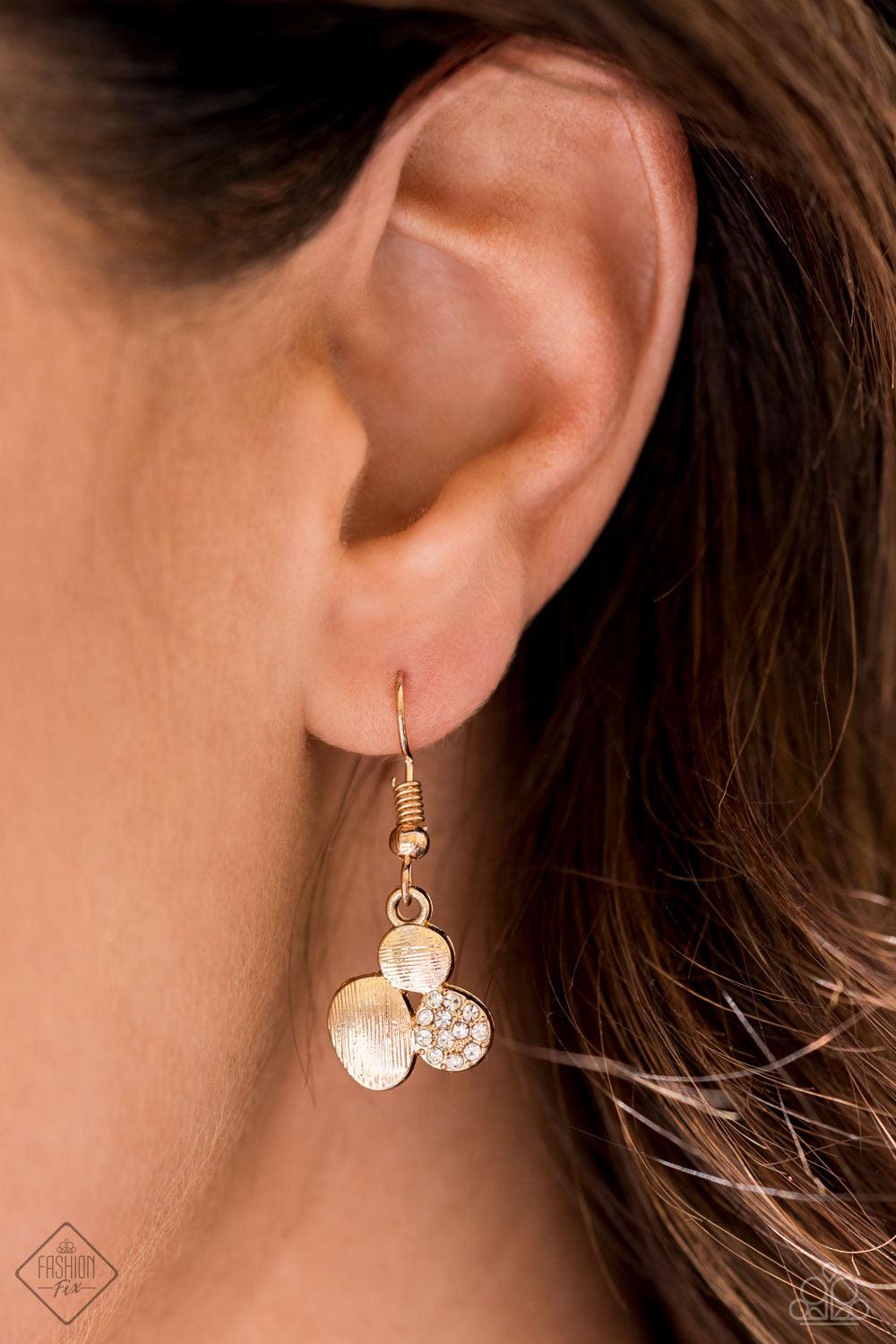 Paparazzi Accessories A Hard LUXE Story - Gold A collection of asymmetrical oval discs connect into a clustered pendant below the collar for a refined flair. Etched linear textures or white rhinestones adorn each disc, offering a gorgeous collision of tex