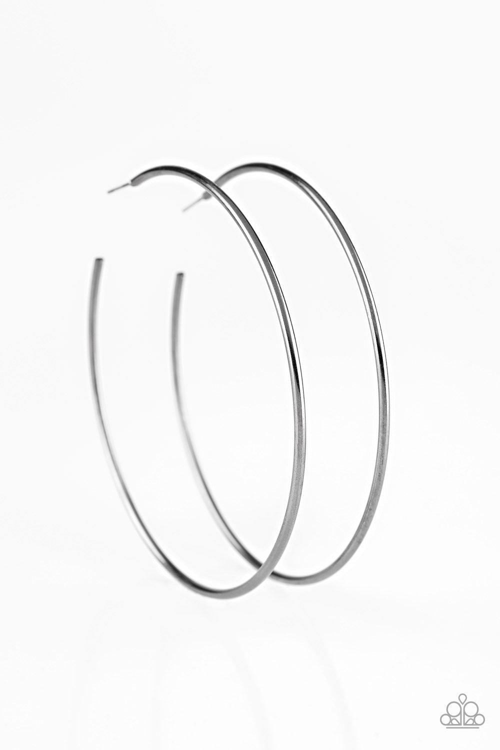 Paparazzi Accessories Meet Your Maker - Black A skinny ribbon of gunmetal curls into a bold hoop for a dramatic look. Earring attaches to a standard post fitting. Hoop measures 3” in diameter. Jewelry
