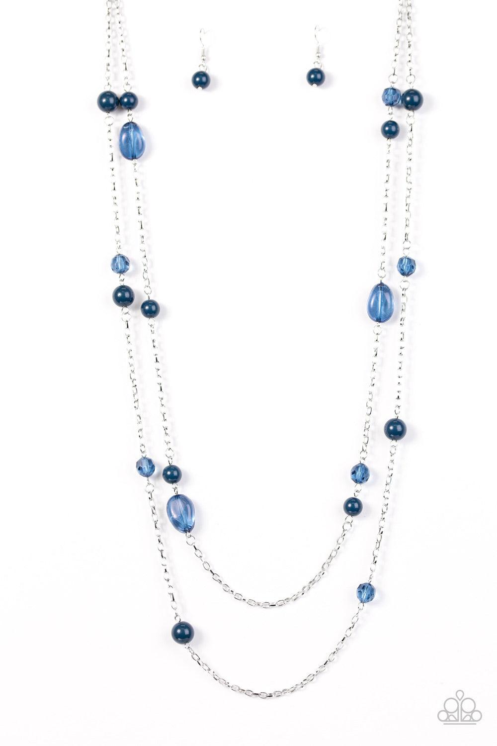 Paparazzi Accessories In Your Gleams - Blue Tinted in the refreshing shade of Navy Peony, polished, translucent, and crystal-like beads trickle along two shimmery silver chains for a whimsical look. Features an adjustable clasp closure. Sold as one indivi